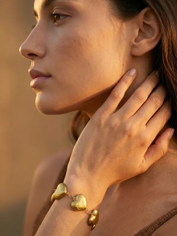 Dilruba Collection Gold-Toned Heart Charm Bracelet for Women | Elegant Statement Chain Bracelet for Everyday & Party Wear